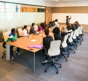 Professional team engaged in a collaborative boardroom meeting with a presentation in progress.